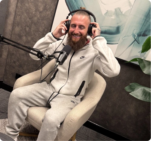 Brodie Nitro speaking into a microphone on a podcast